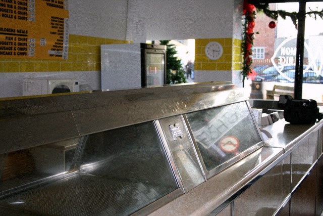 Yellow & white tiles in The Lemon Plaice Chip Shop, Axminster. Viewed from the rear of the customer area.