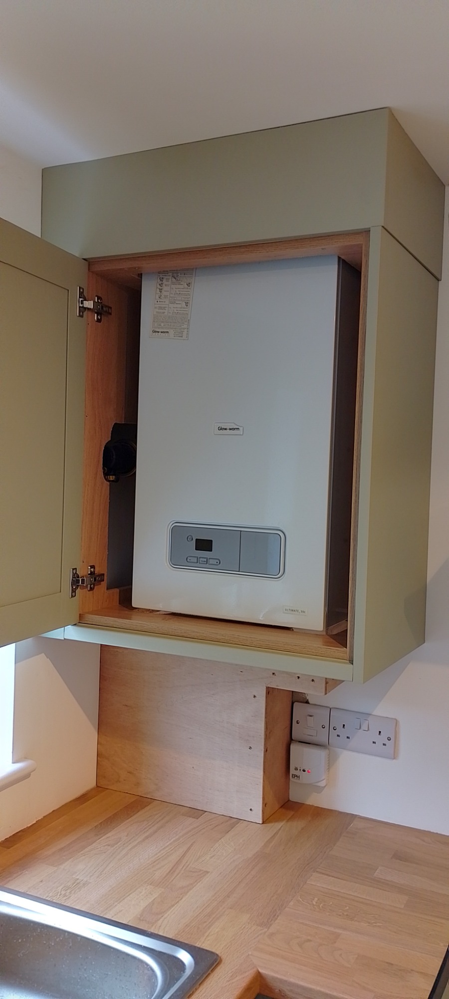 Gas combi boiler was installed and enclosed in a wall cupboard. Gas combi boiler was installed and enclosed in a wall cupboard.