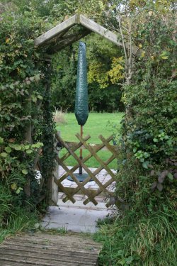 Archway to secret garden and BBQ area. Archway to secret garden and BBQ area.